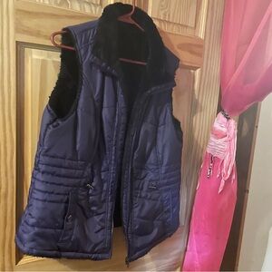 Vest purple.  Black on one side with pockests Reversible one size fits all M-L